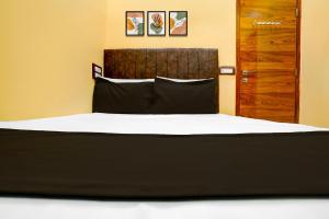 Postel nebo postele na pokoji v ubytování HOTEL O M.M RESIDENCY + 21 fotografií