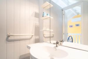 Ένα μπάνιο στο Appartement Coconut