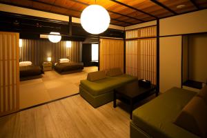 a living room with a couch and a bed at Hotel Clio Court Hakata in Fukuoka +94 photos