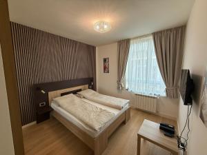 Postel nebo postele na pokoji v ubytování BelgradeWATERFRONT - Apartments