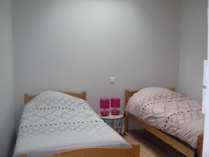 Ένα ή περισσότερα κρεβάτια σε δωμάτιο στο Aux vieux fours 4 chambres 2 salle d'eau