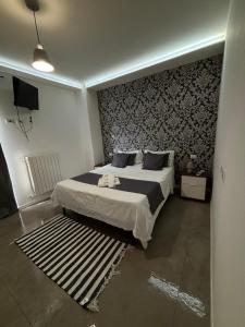 Ένα ή περισσότερα κρεβάτια σε δωμάτιο στο Conte Durini Apartments & Rooms