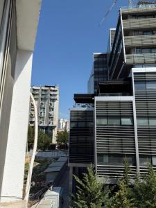 a view of a tall building in a city at Estel Apartament in Tirana