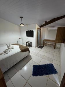 Postel nebo postele na pokoji v ubytování Pousada Recanto Guará