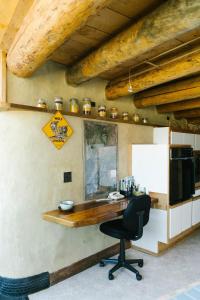 an office with a desk and a chair in a room at Unique and Modern Lodging with Exceptional Features in Paradise Valley, Montana in Flying Y Ranch Airport