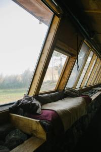 a bed in a room with a large window at Unique and Modern Lodging with Exceptional Features in Paradise Valley, Montana in Flying Y Ranch Airport