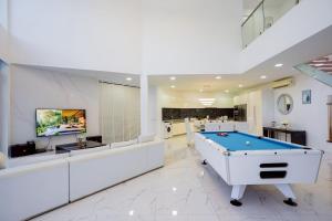 a large living room with a pool table at Wonderland Sapphire 8 Bedroom Luxury Villa in Pattaya South
