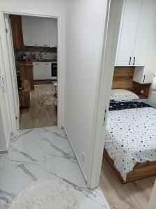 Ένα ή περισσότερα κρεβάτια σε δωμάτιο στο INKOGNITO Centar 39 +13 φωτογραφίες