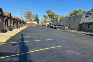 a shadow of a person walking down a street at Des Plaines Motel By OYO O'Hare Airport Chicago in Des Plaines