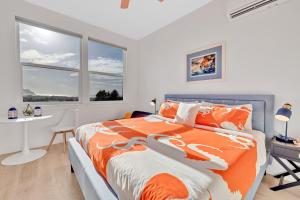 a bedroom with a bed and a desk and a window at Deja View - Ocean View Neskowin Luxury in Neskowin