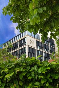 a large white building with a lot of windows at citizenM Tower of London in London