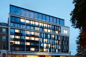 a tall office building with many windows at citizenM Tower of London in London