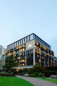 a large building with a sign on the side of it at citizenM Tower of London in London