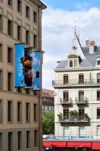 a building with a sign on the side of it at citizenM Geneva in Geneva +32 photos