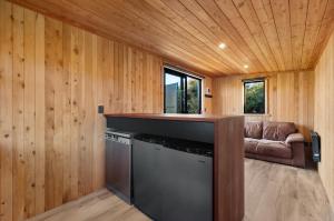 a kitchen and living room in a tiny house at Luxury Container and Cabin with Outdoor Bath in Wanaka +12 photos