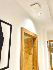 a wooden door in a room with a ceiling at appartement 3 chambres à côté de stade in Tangier +55 photos