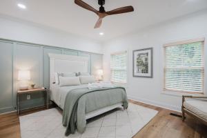 a bedroom with a bed and a ceiling fan at Lowcountry Landing! 3-story Townhouse in Old Town's Promenade in Bluffton