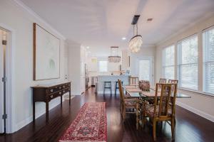 a dining room and kitchen with a table and chairs at Mary Margaret Cottage - Spacious 4 Bed Coastal Home, Historic Old Town Bluffton in Bluffton