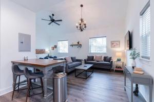 a living room with a table and a couch at Charming Old Town Loft, nestled in the Heart of Historic Bluffton, SC in Bluffton