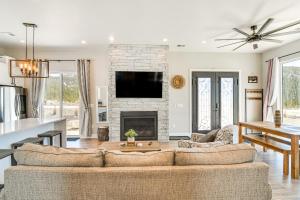 a living room with a couch and a fireplace at Romantic Mountain Retreat with Scenic Views! in Idaho Springs
