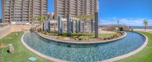 an aerial view of a pool at a resort at 1BR 1BA Ocean View Las Palomas Phase 1 Bld Ruby in Puerto Peñasco