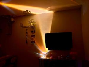 a living room with a flat screen tv on a wall at New flat close to center in Komárov