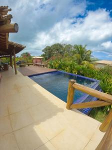 Πισίνα στο ή κοντά στο Sua família em praia privativa com conforto e tranquilidade