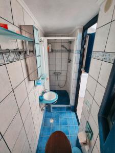 a small bathroom with a sink and a shower at eleni's cozy appartment in Kástron