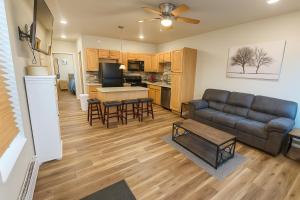 a living room and kitchen with a couch and a table at Downtown Cheyenne in Cheyenne