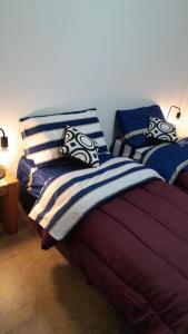 Postel nebo postele na pokoji v ubytování Av Mayo Apt with a view of the Barolo Palace