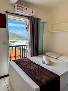 Postel nebo postele na pokoji v ubytování Hospedatom - Incrível Apartamento Frente Mar Praia Grande