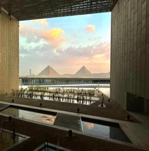 a view of the pyramids from inside a building at Falcon pyramids inn in Cairo