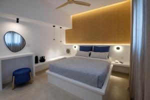 a bedroom with a bed and a mirror and a chair at Antara in Stení