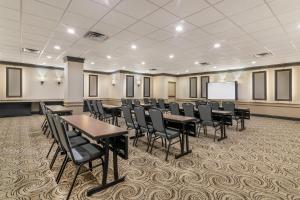 a conference room with tables and chairs and a screen at Best Western Plus Waltham Boston in Waltham +44 photos