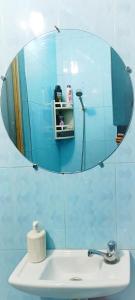 a bathroom with a mirror over a sink with a mirror at Aziz House 2 in Tan-Tan +28 photos