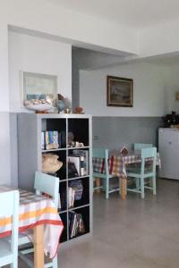 a room with a book shelf with chairs and a table at The edge of the Atlantic  +31 photos