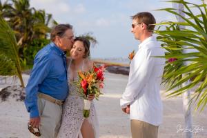 a woman is talking to two men on the beach at Enjoy Savings Oceanfront Private Estate By Alom in San Pedro +151 photos