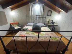 a bedroom with a bed with a black bed frame at Gerali house in Fáros