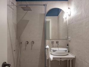 a bathroom with a glass shower and a sink at Cielo Cagliari For2 Design - Comfort Solo Adulti in Cagliari +22 photos