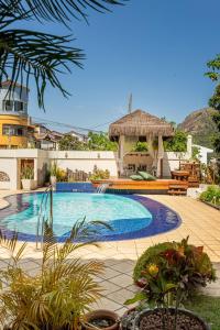 a swimming pool with a gazebo and a resort at Mansão em Niterói com Piscina e Vista Mar | LD 58 in Icaraí