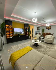 a large living room with a couch and a table at Coastal Gem 3BR, Pool, 5 Min Walk to Beach - Nyali in Nyali