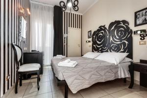 Ένα ή περισσότερα κρεβάτια σε δωμάτιο στο Hotel Le Cinéma