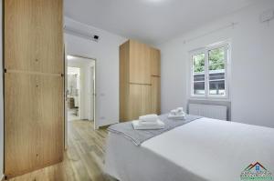 Ένα ή περισσότερα κρεβάτια σε δωμάτιο στο Casa Giuditta with Air Conditioning and Pool