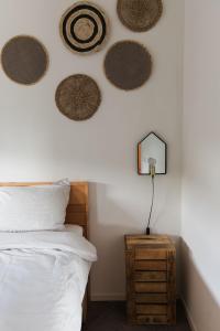 a bedroom with a bed and fourwheels on the wall at Hof Driewegen in Driewegen
