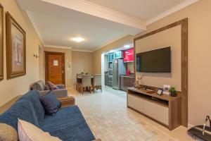 TV a/nebo společenská místnost v ubytování 1 quadra da Catedral em Canela