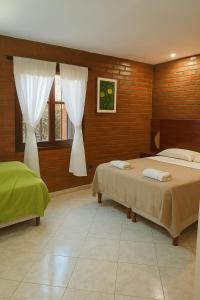 Postel nebo postele na pokoji v ubytování Posada Madre America