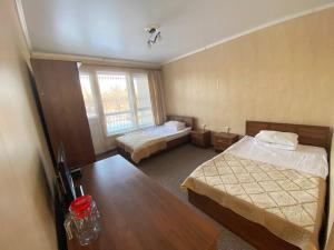 a hotel room with two beds and a window at Turgen Resort in Taūtürgen +15 photos