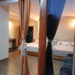 Postel nebo postele na pokoji v ubytování SL Guest House