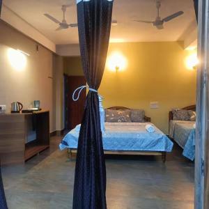 Postel nebo postele na pokoji v ubytování SL Guest House