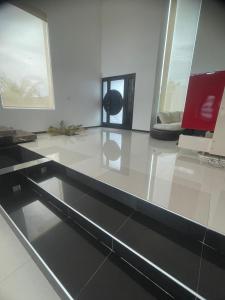 a living room with a table and a couch at Hotel Casa Bendicion in Los Limones